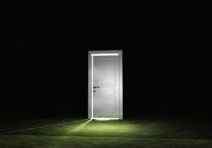 Single door emits light in dark scene